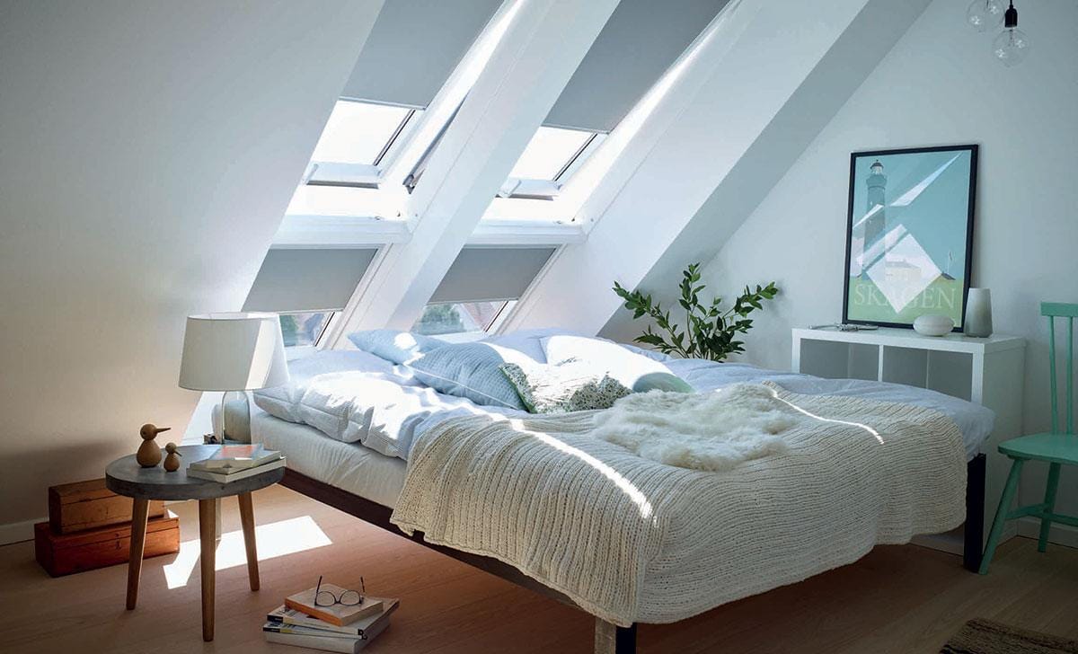 Blackout roof window blind fitted in a Belfast attic bedroom
