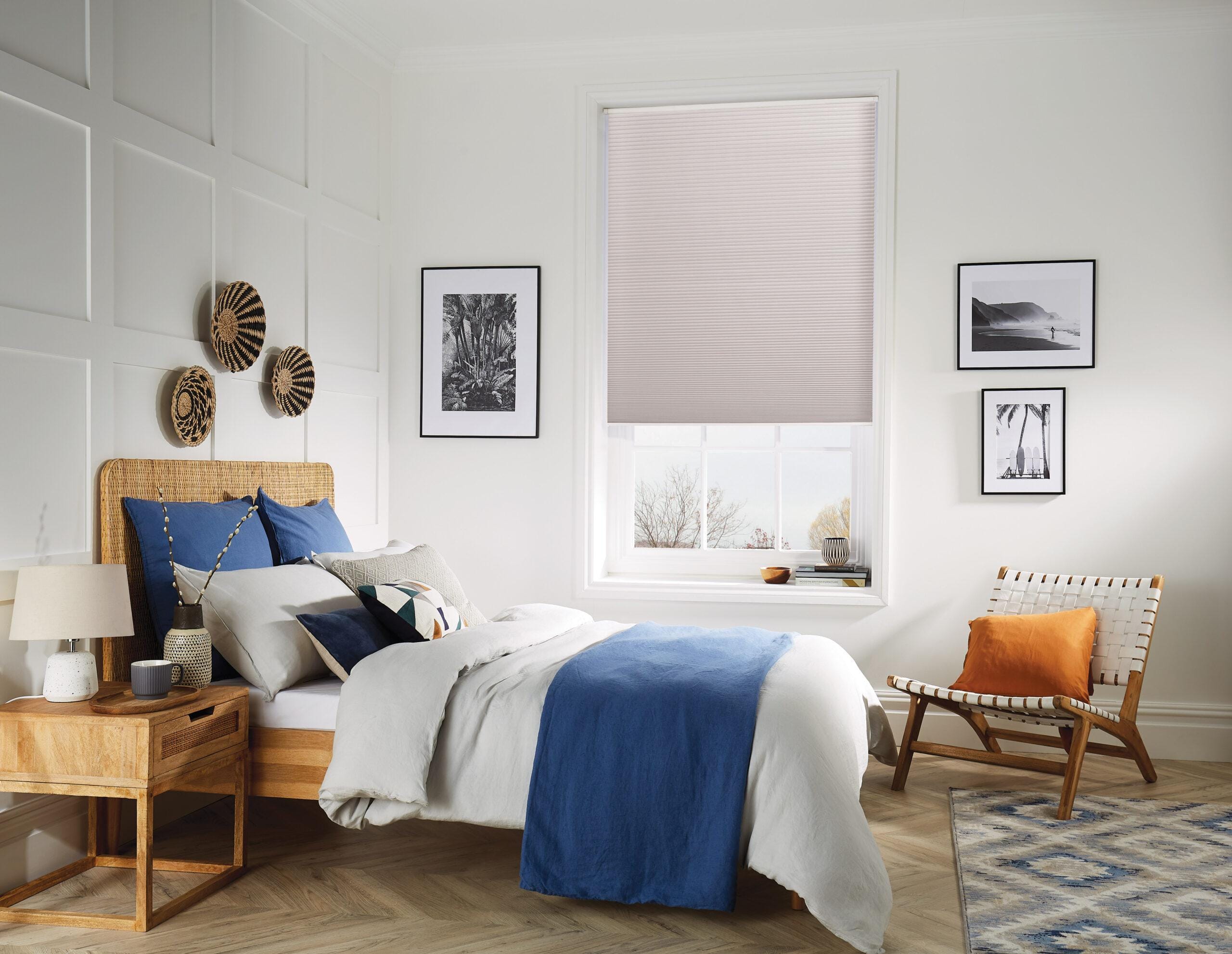 Cellular honeycomb blind with a blackout fabric in a bedroom